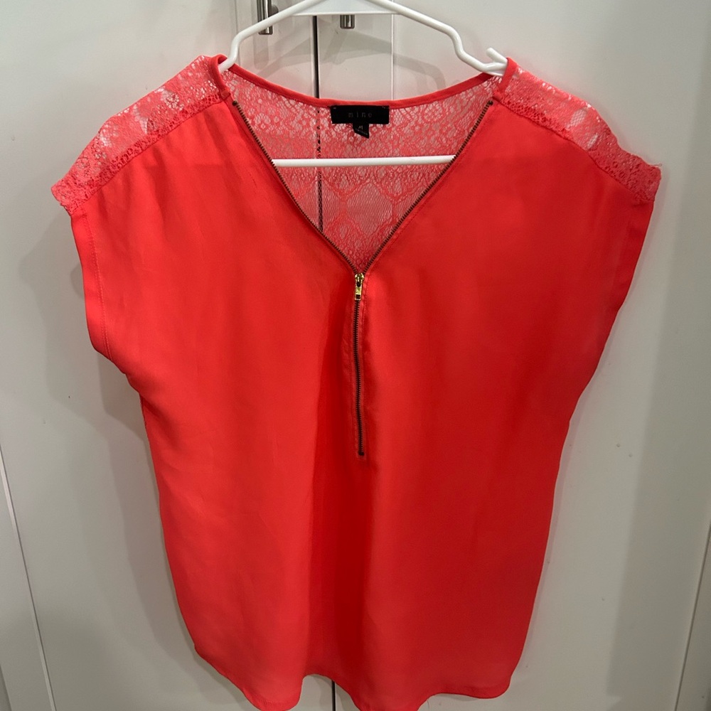 Zip front top, lace embroidered back. Bright salmon